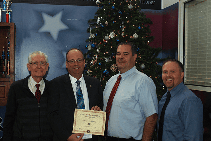 Springville Kiwanis presents cash awards to Reagan Academy Left to Right: Larsen Boyer (Kiwanis Treasurer), Mike LeFevre (Kiwanis President), Justin Riggs (Reagan Academy Principal), Lanny Adamson (Reagan Academy Assistant Principal)