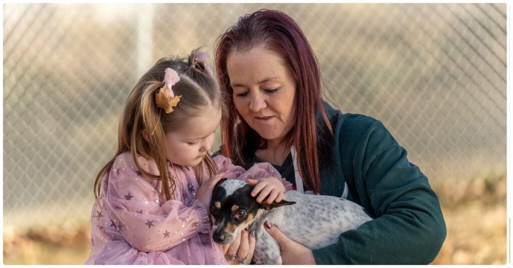 Brandi Buys with her grand-daughter Paisley and recently adopted dog Bo.