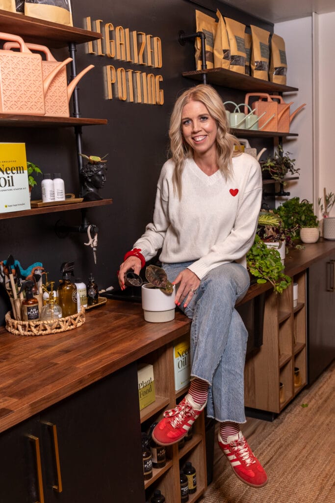 Heather Bringhurst sitting near the Legalized Potting section.
