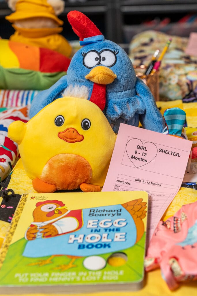 Hearts Knit Together - Kit assembly. Each Kit is made by a volunteer who puts love into the creation of a package to end up in the arms of someone in need. 