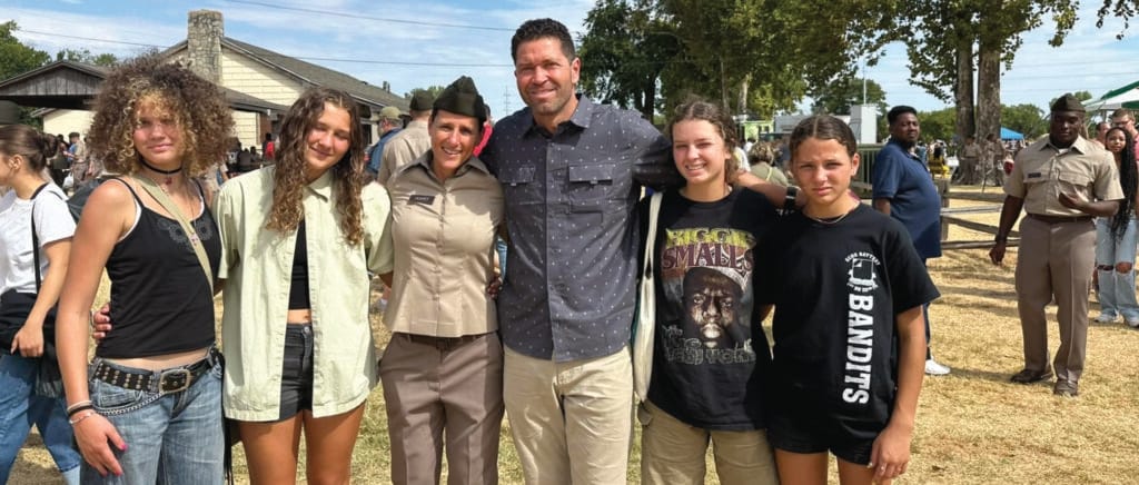 Jennifer Hughes (46),  with family after completing basic training.