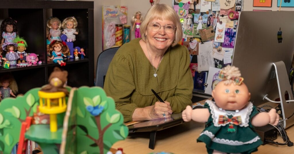 Stefanie Eskander works on a digital illustration using a Cintiq drawing monitor, alongside Adobe Photoshop, Illustrator, and Procreate. Once a traditional artist, she now creates all of her designs digitally.