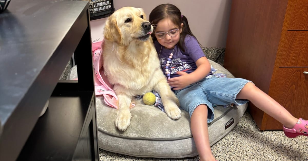 Vivian Higgs with her new female service dog named Babe.